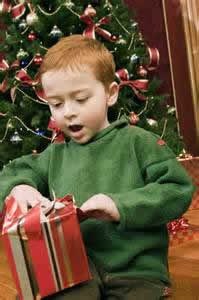 Boy opens Christmas gift